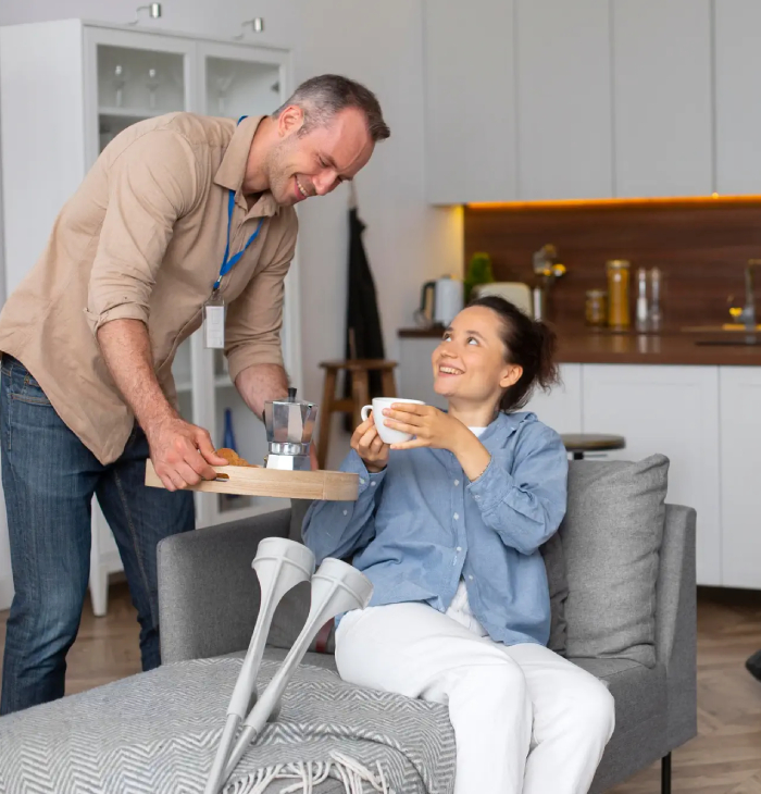 A man provides household task assistance NDIS to a woman